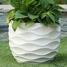 Paired with plant pots, they can create a layering effect and provide dramatic visual interest for your exterior. Cowie Wavy Mgo Pot Planter Planters Planter Pots Large Flower Pots