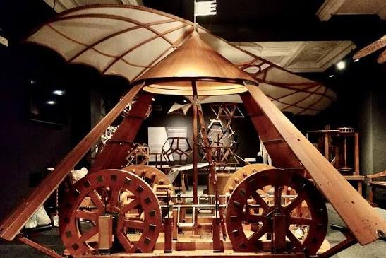 Visitors interacting with Leonardo da Vinci’s wooden tank model in the museum