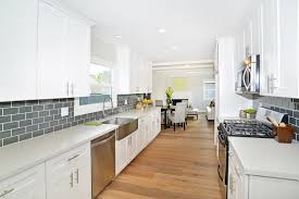 The glass becomes art in itself to give your kitchen a unique style. Flip Or Flop Unique Use Of Space In White Modern Kitchen White Modern Kitchen Modern Kitchen Kitchen Design
