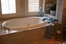 Do you know how much money we saved on the kid's bathroom renovation by tiling the tub surround ourselves? Beautiful Garden Tub Surrounded By Tile With A Tile Chair Rail Across The Walls By Lufriu Marble Www Lufriu Com Tub Surround Garden Tub Corner Bathtub
