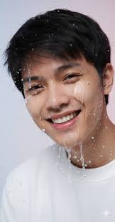 Promt:💦 “make this photo a hyper-realistic close-up portrait of a young  man with sharp features, wet skin, and water. splashing dramatically over  his face. droplets stream down his cheeks, lips, and chin,