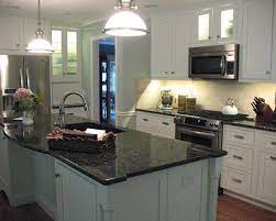 Lighting will make the uba tuba granite to stand out. Uba Tuba Granite White Cabinets Www Stkittsvilla Com Replacing Kitchen Countertops Kitchen Remodel Kitchen Cabinet Design