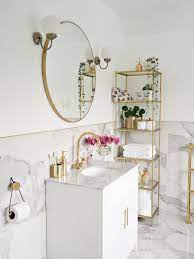 Lady with golden hair in blue dress. Marble Gold Bathroom Restroom Decor Gold Bathroom Decor Bathroom Interior Design
