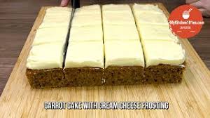 Top this classic carrot cake with moreish icing and chopped walnuts or pecans. Carrot Cake With Cream Cheese Frosting Mykitchen101en Youtube