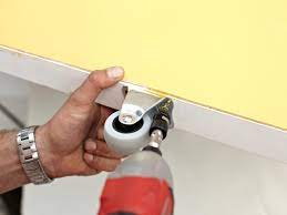 Hold the door in place and mark holes for your screws to attach the plumbing pieces to the wall (you don't have to mark them, but if for any reason the door shifts, it's easier to know where things line up). How To Build And Install A Sliding Door How Tos Diy