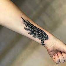Tatuaz Skrzydel Znaczenie Symbolika 84 Zdjec Wrist Tattoo Cover Up Inside Wrist Tattoo Foot Tattoos For Men