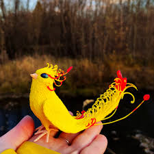 Paradise bird. Yellow fantasy birds. Fantasy figure
