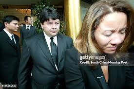 Family members of late Alan Li Fook-sum attends the funeral service... News  Photo