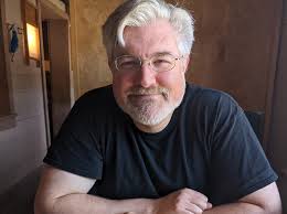 Which Norse deity to call upon for financial wealth and prosperity?