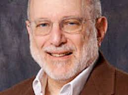 Northwestern's Medill chief John Lavine stepping down