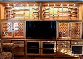 The wood gun cabinet also features tempered glass on the door so the guns can be viewed or displayed. Amish Woodworking Gun Cabinets
