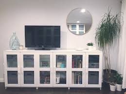 Minimalist Inspriation Ikea Brimnes Glass Cabinets Vintage Brass Flower Pot Jonathan Adler Decorative Vas Living Room Console Living Room Designs Home Decor