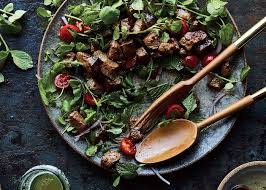 At a steakhouse and at home. Shaking Beef Steak Salad Recipe