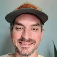 Cardinal chasing away a cowbird (I think). Berks County, Pennsylvania.