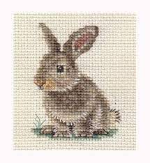 This cross stitch pattern of a rabbit sitting on a red cloth. 59 Cross Stitch Rabbits Ideas Cross Stitch Cross Stitch Animals Stitch