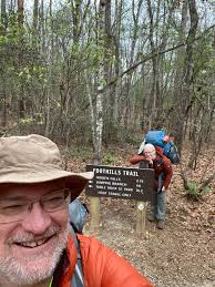 What are some strategies for foot care while hiking in rainy conditions?