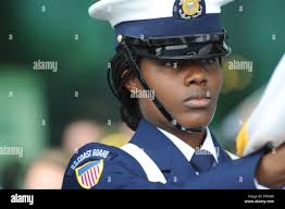 Coast Guard Honor Guard member Seaman Sonnisha Williams participates in the  presentation of the colors at a Coast Guard Band concert, Chester,  Pennsylvania, June 9, 2018. The concert was part of the