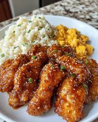 Crispy Honey Chicken is the ultimate sweet-and-savory indulgence—crispy, golden  chicken pieces coated in a light, airy batter and drenched in a sticky honey  glaze that's rich, glossy, and finger-licking good. This takeout