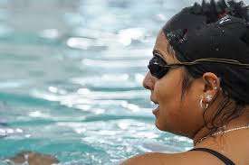 Detroit's Western International HS swim coach makes a splash in and out of  the pool