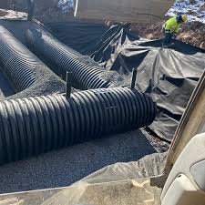 It's snowing out but we still push forward our team installing a little  drainage system Monsey, Ny