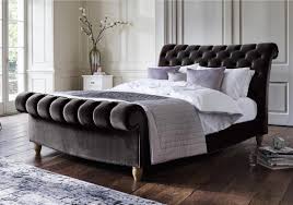 Choose a headboard to match your personal style, whether it be upholstered, wooden, or even carved for a more traditional look. Opulent Handcrafted Bed Frame With Scrolling Headboard And Footboard And Deep Buttoning Dark Grey V Bed Furniture Fabric Upholstered Bed Upholstered Bed Frame