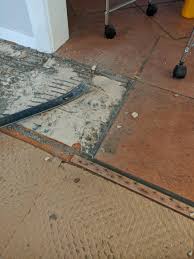 Self adhesive vinyl floor tiles on chipboard. Removing Old Terracotta Tiles What Are These White Sheets For Between The Chipboard Floor And The Tiles Diynz