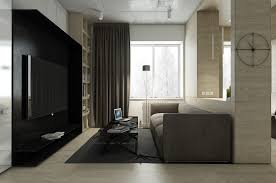 Such a sunken living room area is usually turned into a conversation and entertainment pit. Small Apartment Design With Dark Color Shades That Perfect For A Young Couple Roohome