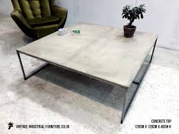 An expansive room calls for a large coffee table to ground it. Concrete Coffee Table