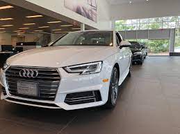 Angled Front View Of Ibis White 2018 Audi A4 Located At Audi Of Bridgewater Nj Audi Dealership Used Luxury Cars Audi