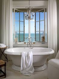 The national electric code (nec) from 2011 requires that any part of a light fixture, including crystals dangling from chandeliers, must be a minimum of 8 feet above the highest portion of a tub's walls. 25 Sparkling Ways Of Adding A Chandelier To Your Dream Bathroom