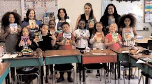 Rubin Pollack Education Center Graduates Twenty-one Second Graders Receive  Books from Monticello Kiwanis Club