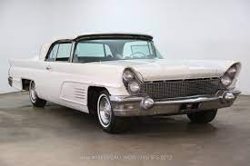 This continental rides on its proper white wall tires, as the power operated convertible top, nd is likely one of fewer than 500 remaining of the 2,044 that were produced in 1960. 1960 Lincoln Continental Convertible Beverly Hills Car Club