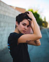 Next video girl in xmas bikini dancing around while smoking a joint. Women Hairstyles Short Curls Tomboy Hairstyles Lesbian Hair Androgynous Hair
