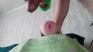 Guy moaning and shaking while cumming inside a fake pussy