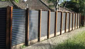 Galvanized metal fence looks better with a wooden cover. Awesome Privacy Fence Ideas For Residential Homes Privacyfence Fence Fenceideas Fencedesign Corrugated Metal Fence Backyard Fences Metal Fence