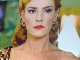 She snoops in Sofia's room and finds a handkerchief belonging to Javier!