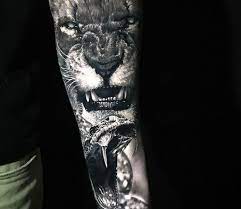 These tattoos became intricate works of art that detailed not only an inmate's crimes, but a good portion of. Lion And Snake Tattoo By Chris Showstoppr Post 27060 In 2021 Snake Tattoo Design Lion Tattoo Snake Tattoo
