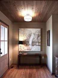 The picture shown below is a combination of rustic and modern design where the pallet wood ceiling features a modern designed chandelier in the middle. Wood Ceiling Design Home Wood Ceilings House Design