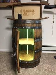 Rollers inside the cabinet make contents easy to load and remove. Oak Barrel Liquor Cabinet Gears Beer