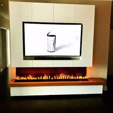 From here you need to decide on your style and design, and there are hundreds and hundreds of gorgeous fireplace, insert and stove styles and designs to choose from. Nero Fire Design On Twitter Custom Electric Fireplace 8 Long With A Lot Of Storage Above It Design And Handmade By Us