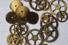 Gear ratios are chosen to convert the time counted by the escape wheel into minutes and hours. Vintage Cogs Clock Gears Steampunk Supplies Etsy Vintage Clock Clock Gears Clock Parts