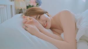 Good morning with young and beautiful Korean woman basking in bed