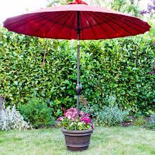 Most of the umbrella stands will stand alone and hold the umbrella up without any type of fastener needed. Made For Shade Diy Umbrella Stand Planter The Home Depot