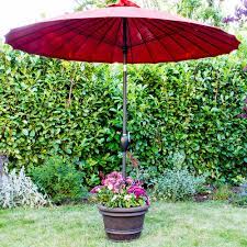 Alternatively, you can use regular stones which you can paint yourself if you're feeling creative. Made For Shade Diy Umbrella Stand Planter The Home Depot