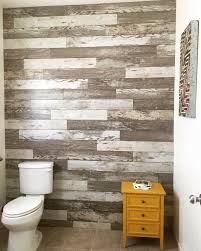 My Husband Created A Laminate Wall Using Bull Barn Oak It S So Awesome Laminate Flooring On Walls Flooring On Walls Laminate Wall