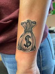A tattoo is a permanent change to your appearance and can only be removed by surgical means or laser treatment, which can be disfiguring, costly and/or painful. 12 Latest And Beautiful Money Tattoo Designs In 2021 Money Tattoo Money Bag Tattoo Hand Tattoos For Guys
