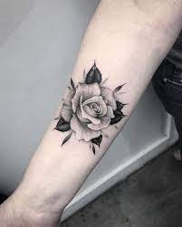 5 Minimalist Tattoos That Can Be Easily Hidden White Rose Tattoos Rose Tattoo Forearm Rose Tattoos On Wrist