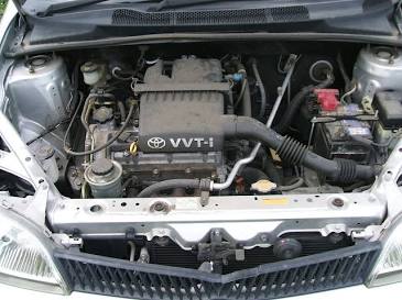 Original, non-disassembled 1.0L 1SZ-FE engine block showcasing full VVT-i branding, AI generated