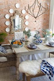Bright white walls and dark accents come together to create a beautiful neutral modern farmhouse dining room! 5 Tips For Creating An Affordable Modern Farmhouse Tablescape