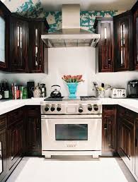 Love How They Added A Splash Of Bright Color With Wallpaper Above The Cabinets Perfect To Avoid Placing Decor With Images Kitchen Inspirations Home Kitchens Chic Kitchen